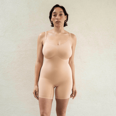 Front view of seamless shapewear bodysuit on model with natural fit and light sculpting support