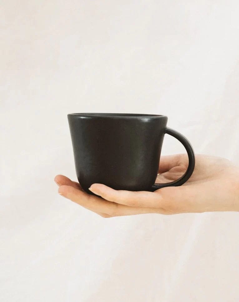 Gharyan Stoneware Japandi Tableware Mug, Matte Black, held for scale