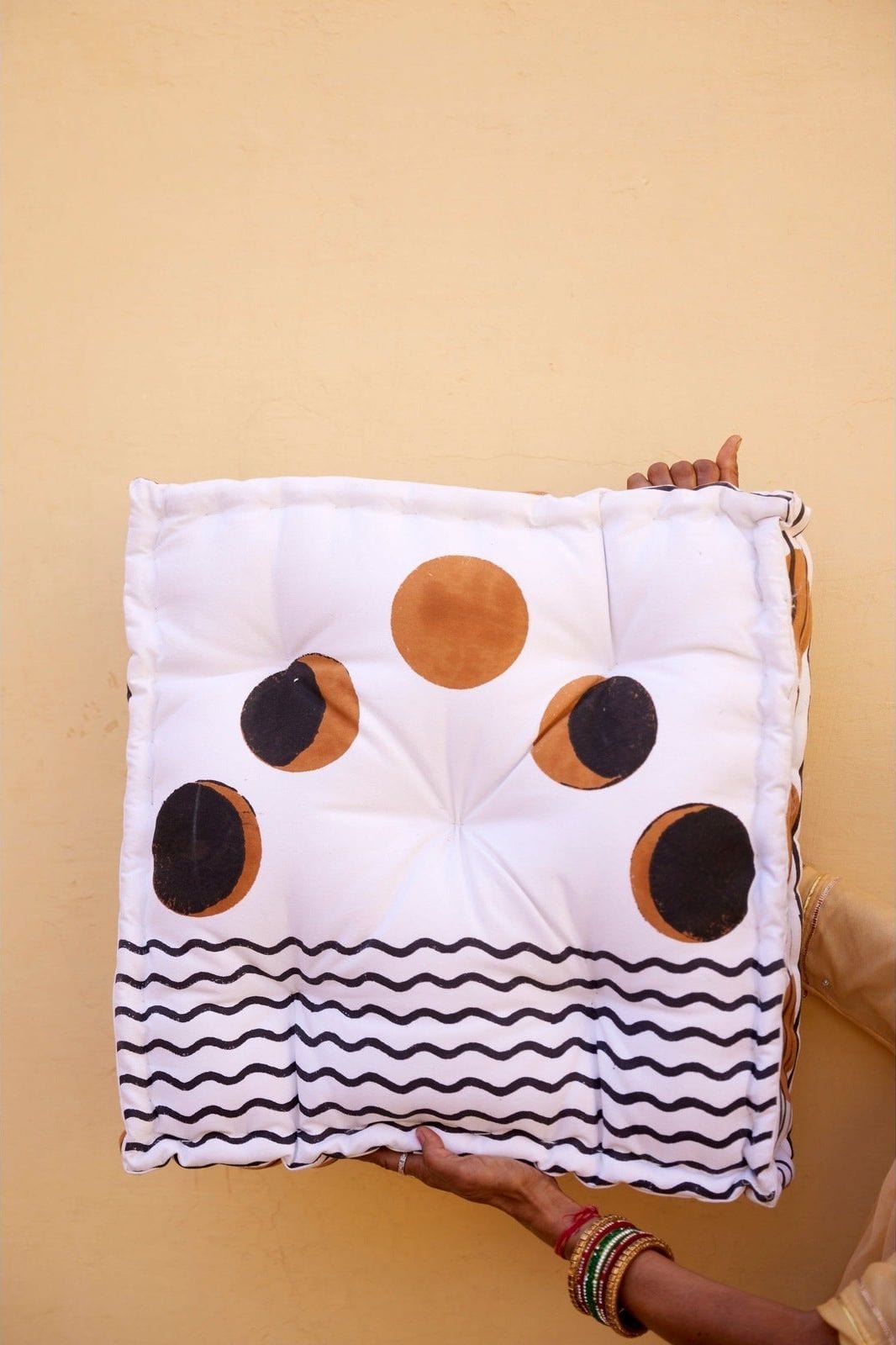 Ascension Floor Pillow held up 