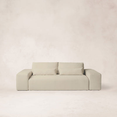 Ojai sofa with low profile, wide arms, and neutral linen fabric