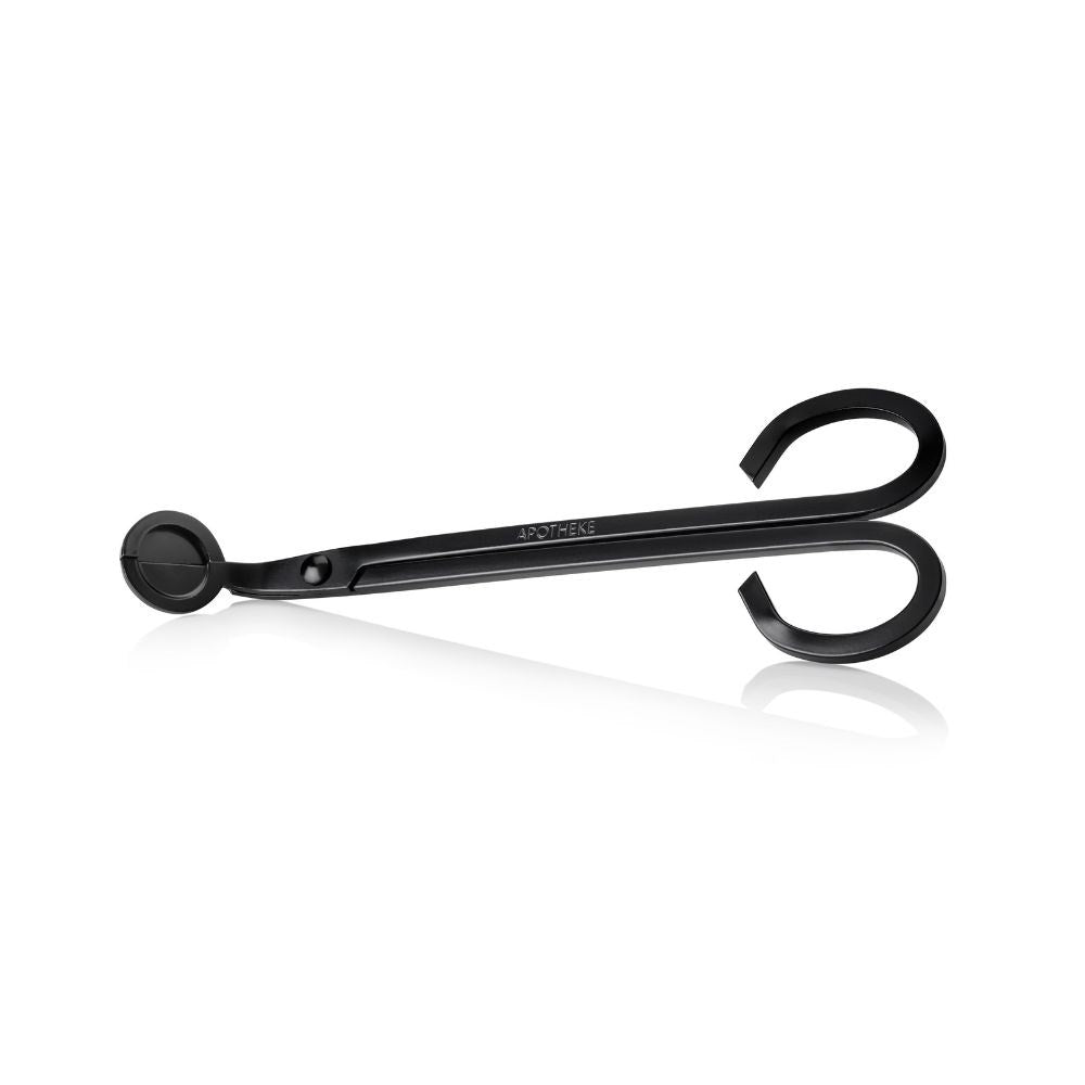 APOTHEKE black wick trimmer with long handles, curved finger loops, and a round cutting head, displayed horizontally on a white background.
