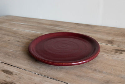 Burgundy glazed handmade earthenware dinner plate