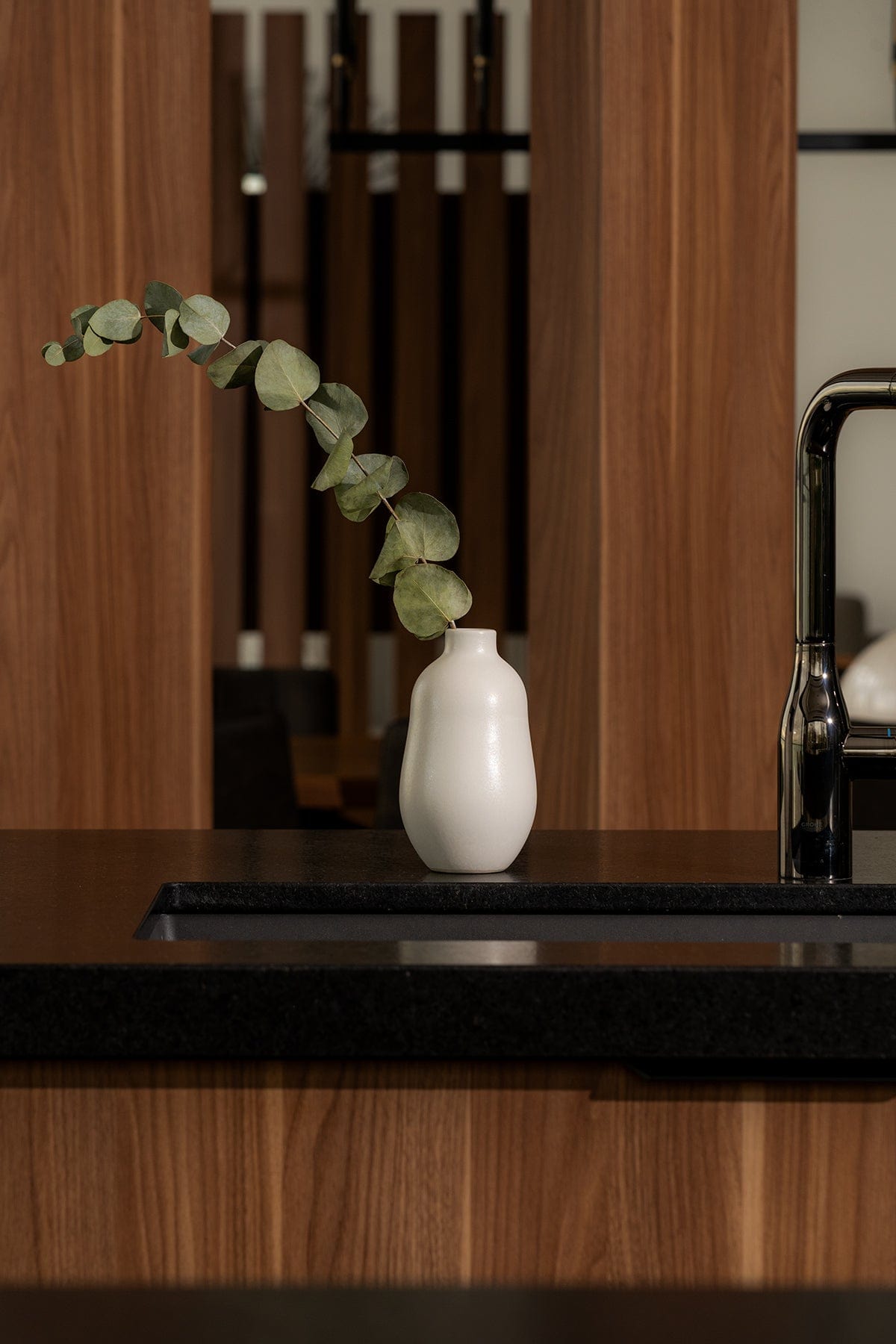 Gharyan Stoneware Vase, white, styled on kitchen counter with eucalyptus branch