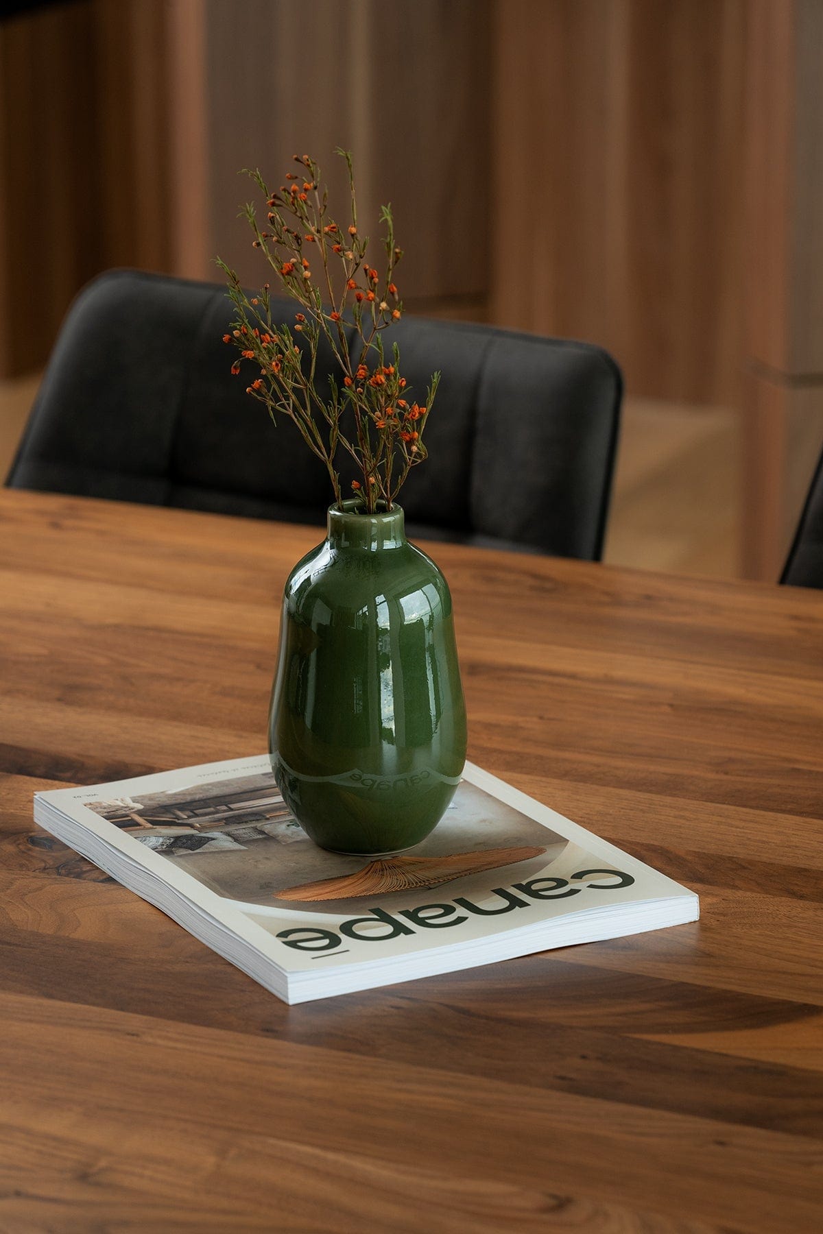 Gharyan Stoneware Vase, green, styled on wood table with magazine