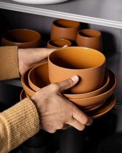 Gharyan Stoneware Japandi Tableware Bowl, Terracotta, person stacking bowls on shelf