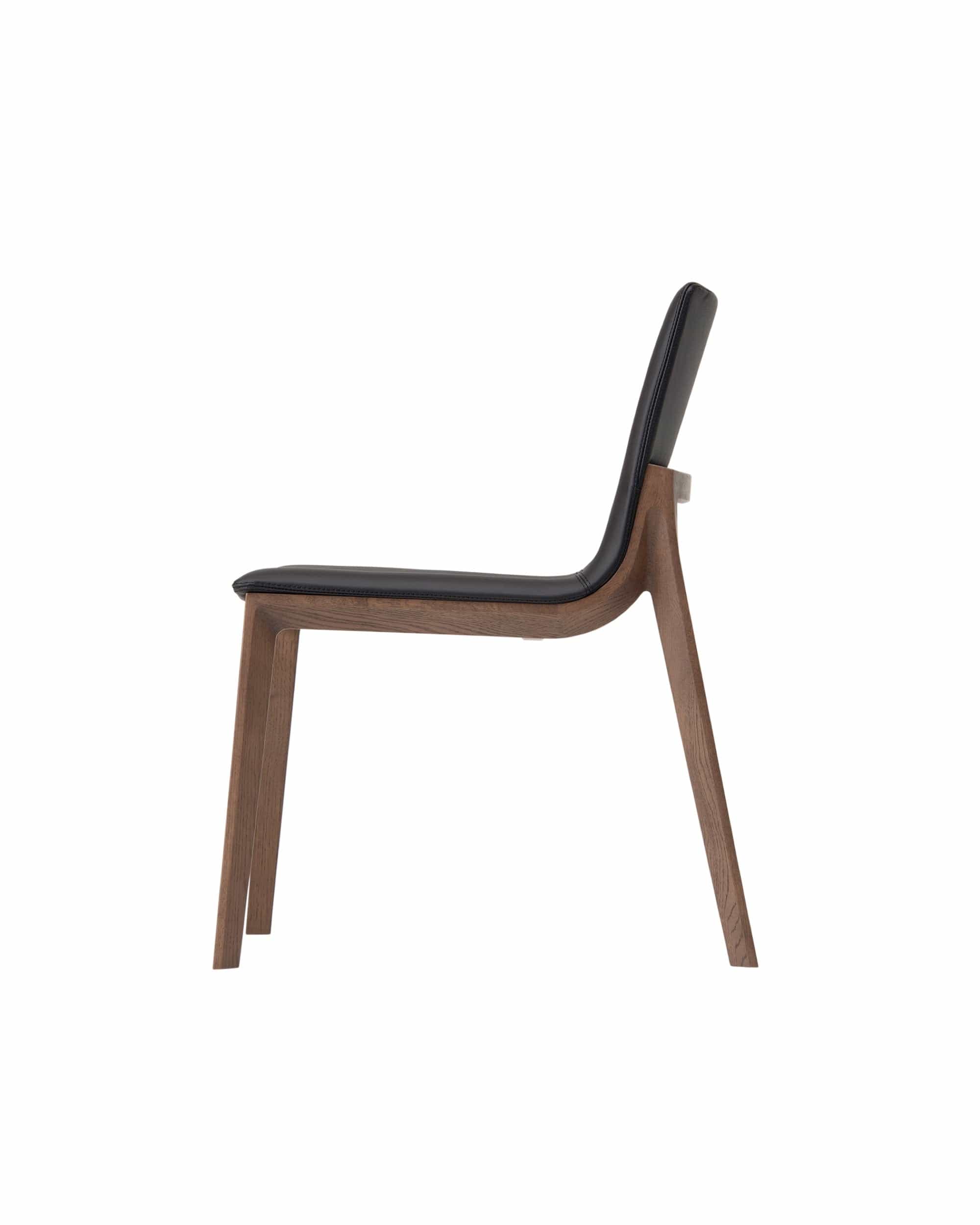 CHALLENGE side chair profile view showing sculpted walnut frame