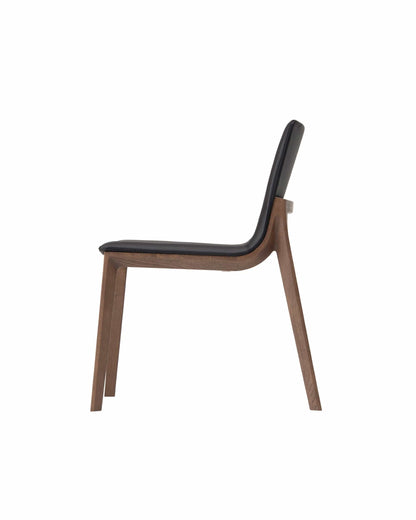 CHALLENGE side chair profile view showing sculpted walnut frame