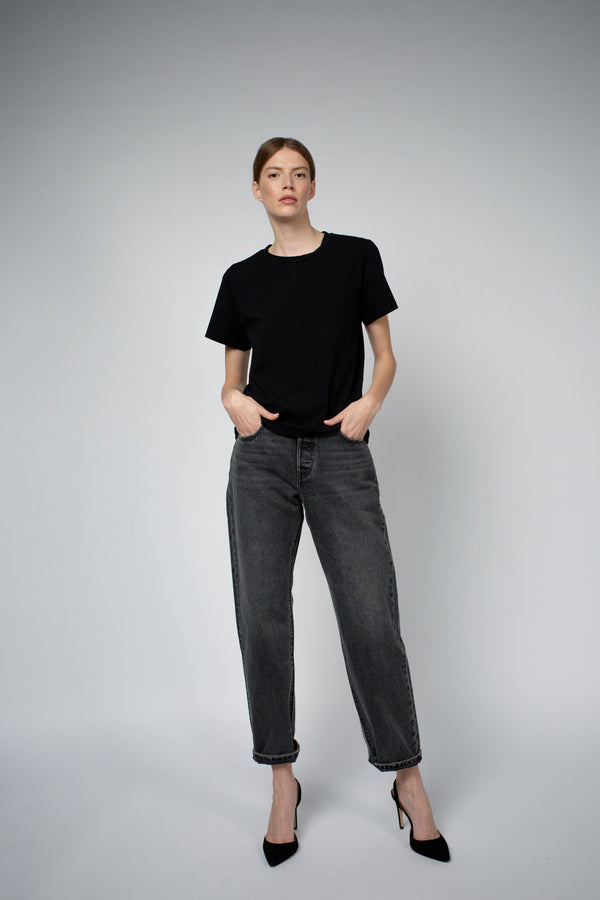 Santicler Adry Organic Cotton Crew Neck T-Shirt in Black – model wearing crew neck tee with gray jeans and heels, full front view, Japandi capsule wardrobe essential