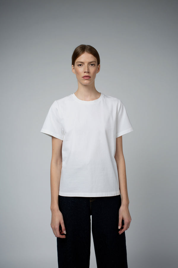 Santicler Adry Organic Cotton Crew Neck T-Shirt in White – model wearing crew neck tee with black wide-leg trousers, full front view, Japandi capsule wardrobe essential