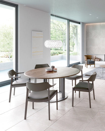CondeHouse WING Armchairs paired with light wood table in Scandinavian Japanese dining room