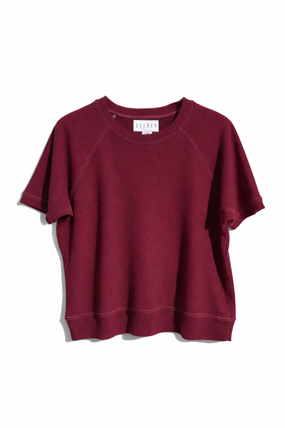 Front product view of the burgundy short-sleeve raglan shirt.