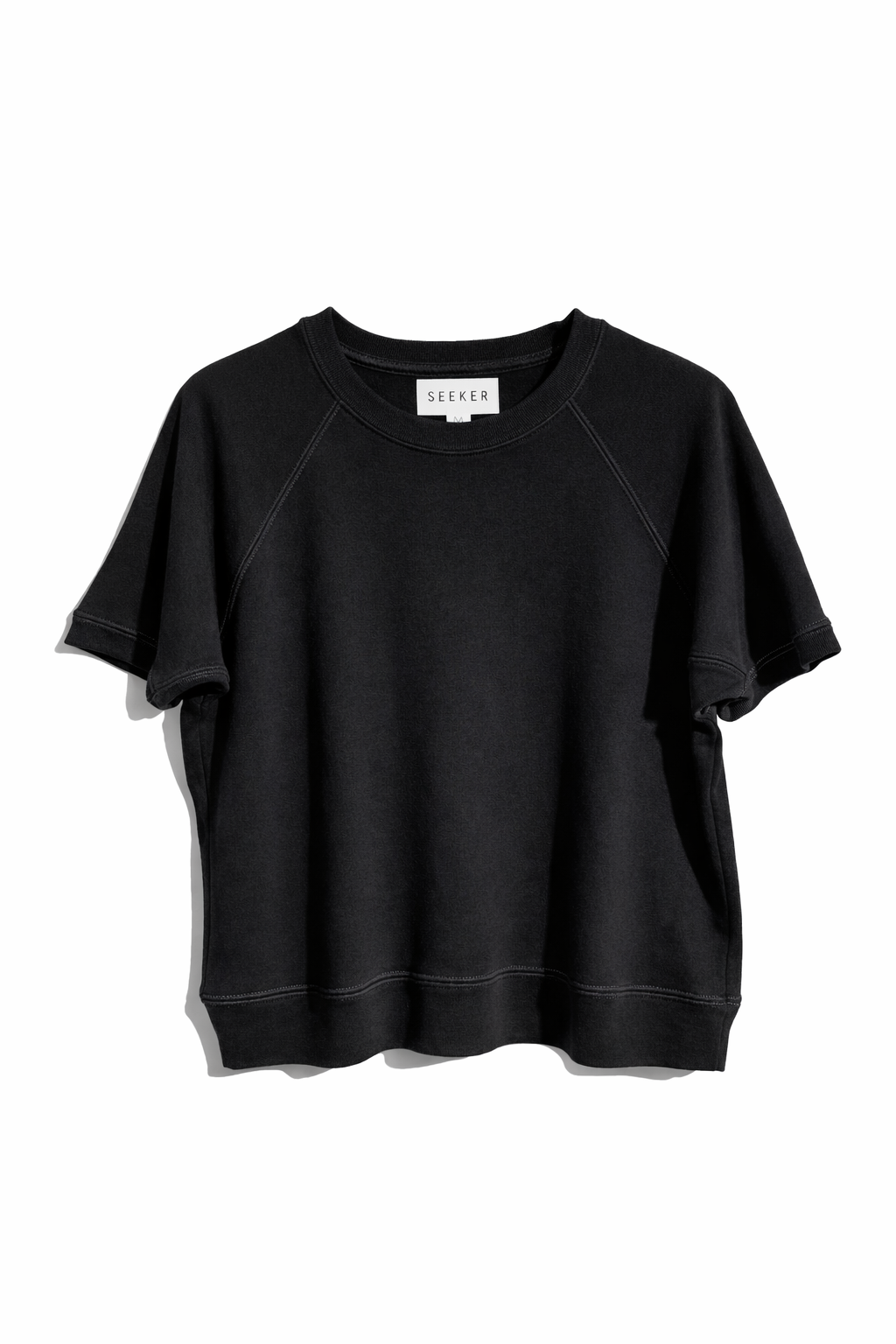 Front product view of the black short-sleeve raglan shirt.