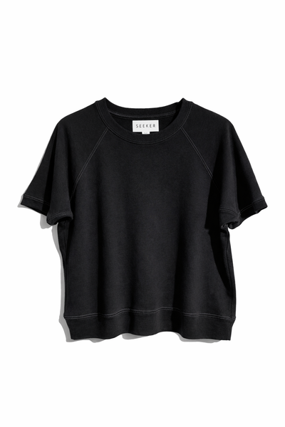 Front product view of the black short-sleeve raglan shirt.