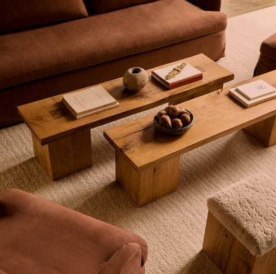 Two Eik Benches with decorative items in a living room setting, the Eik Bench used as coffee tables, by House of Leon.