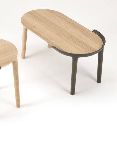 Front view of CRUST coffee table with sculpted solid oak top with outer portion in DGY finish— minimalist Japanese-Scandinavian furniture design.