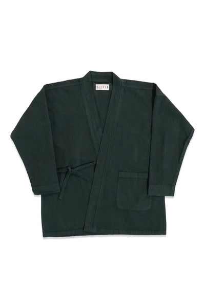 Front product view of the dark forest-green GI wrap jacket with waist ties and patch pockets.