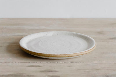 Handmade flat rim earthenware plate in natural glaze