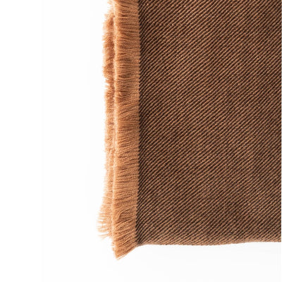 Close-up of the Hay Brown throw’s fine diagonal twill weave and dense golden-brown fringe