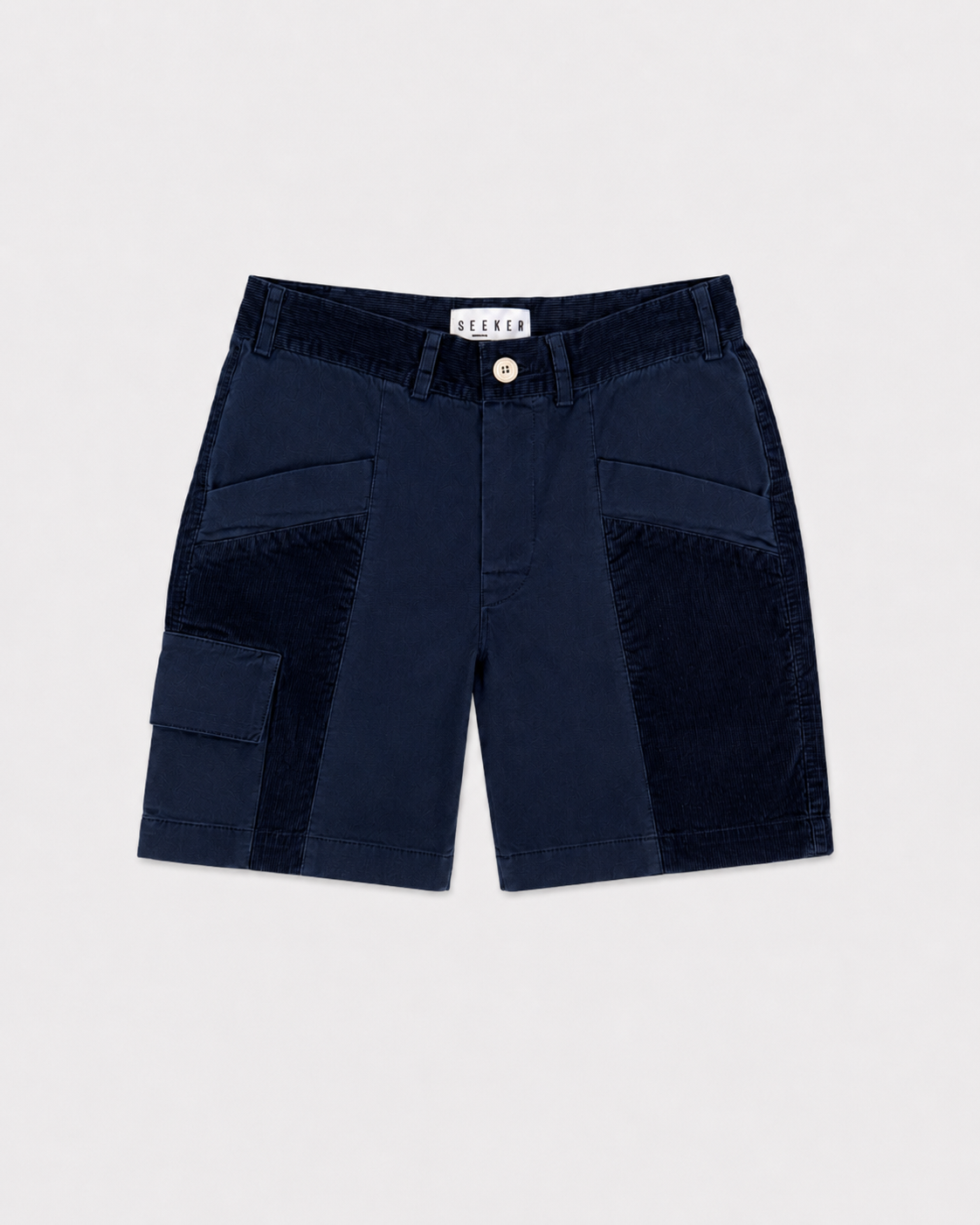Front product view of navy Trek Shorts with dark tonal panels and a buttoned cargo pocket.