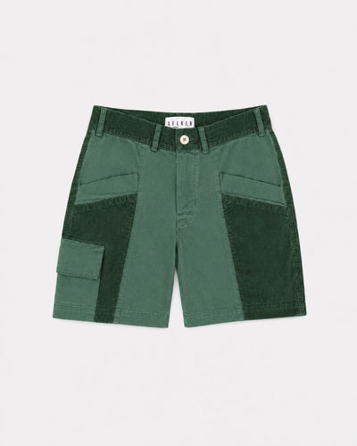 Front product view of green Trek Shorts with dark green panels and a buttoned cargo pocket.
