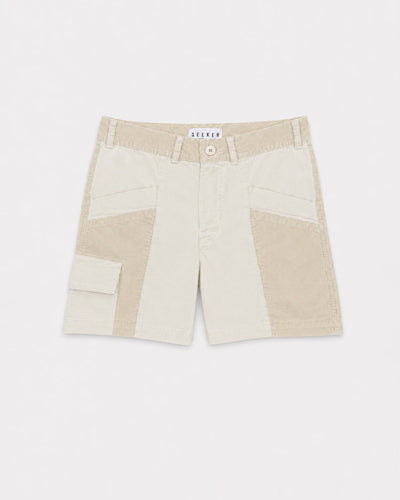 Front product view of cream Trek Shorts with tonal panels and a buttoned cargo pocket.