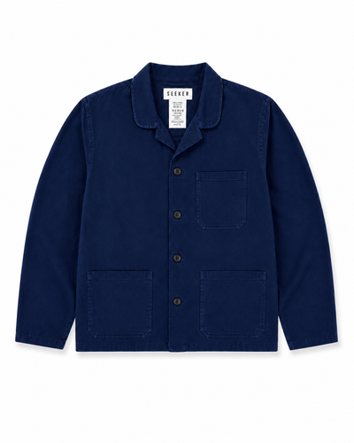 Front product view of the deep navy Travelers Jacket with three patch pockets.