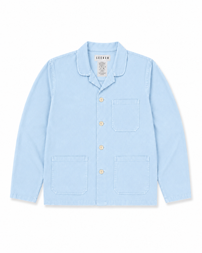 Front product view of the pale blue Travelers Jacket with three patch pockets.