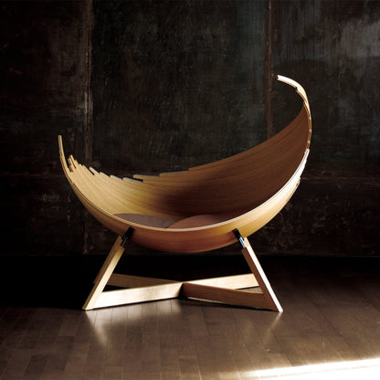Iconic sculptural BARCA lounge chair in natural wood Japandi interior style