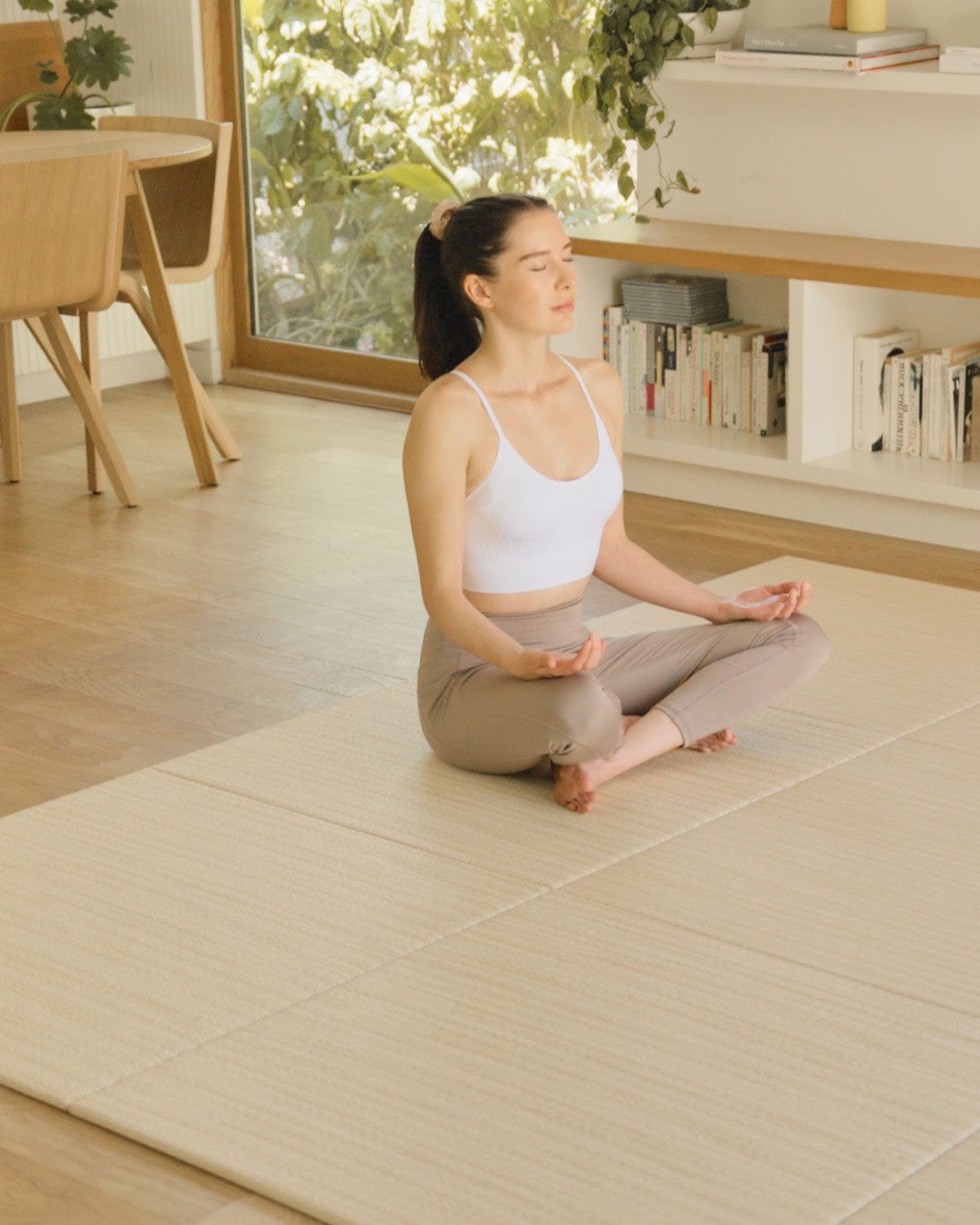 Japandi Tatami Mats Honami WHITE BROWN shown as flooring with 9 mats and woman meditating