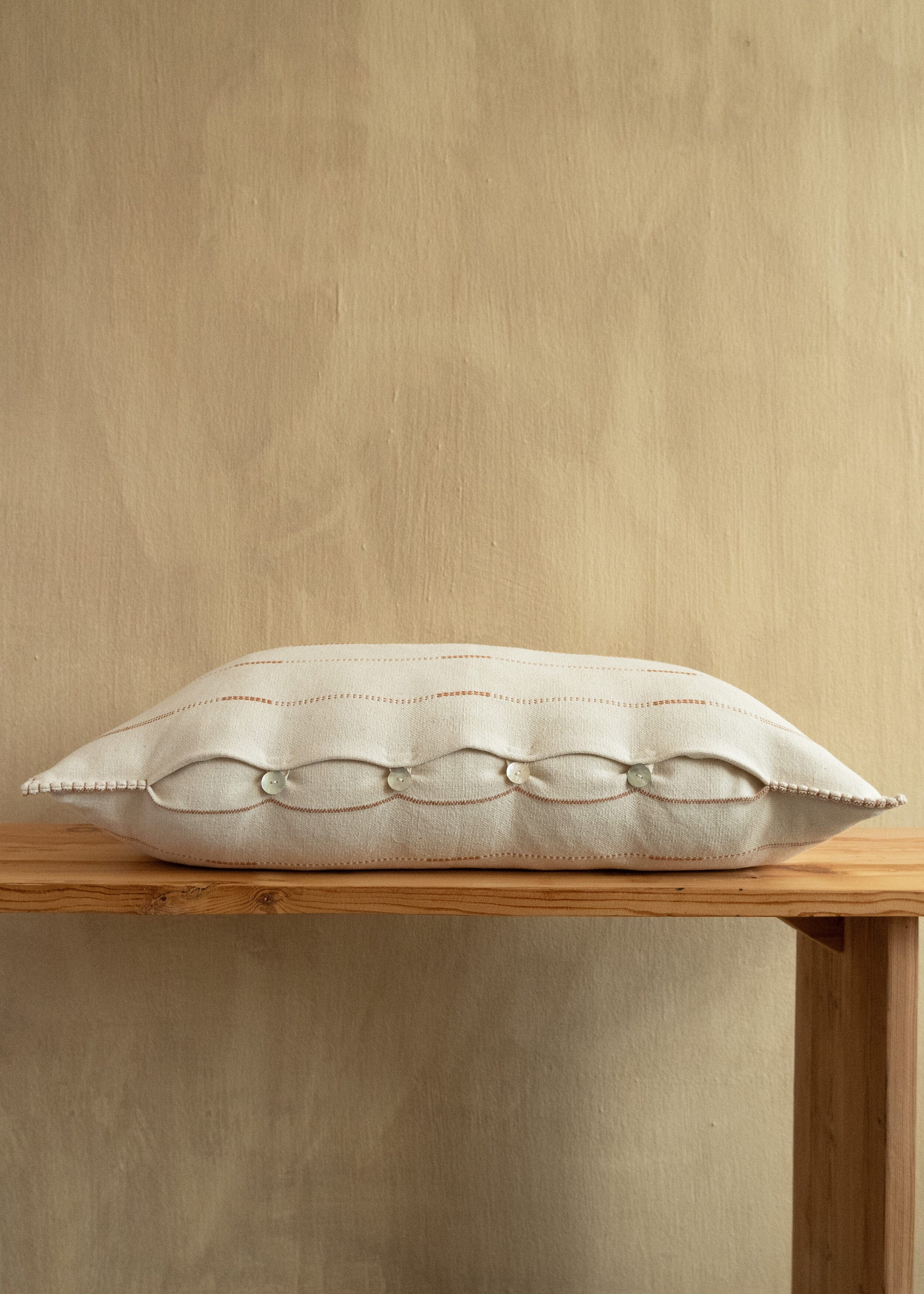Japandi neutral cotton lumbar pillow with mother of pearl buttons
