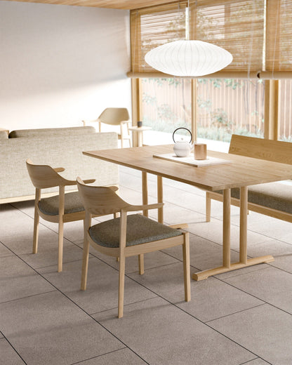 Japanese WING Armchairs by CondeHouse surrounding handcrafted wood dining table