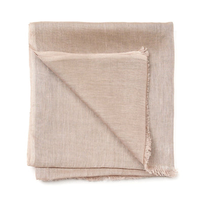 Folded Jute Golden Brown linen-silk scarf showing its lightweight weave, warm neutral color and fine fringe