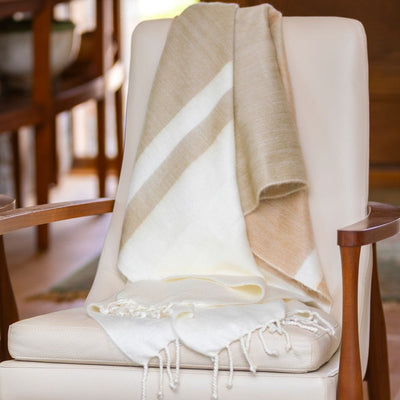 Kallpa Alpaca Throw - Natural Tobacco and Wheat on chair