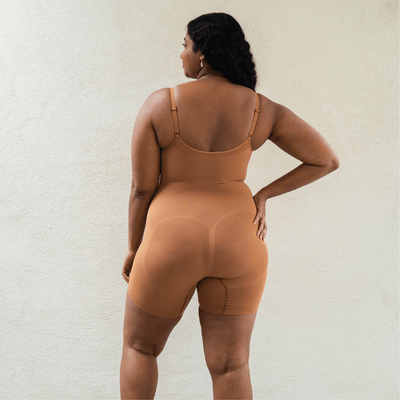 Back view of shapewear bodysuit highlighting sculpting fit and seamless design