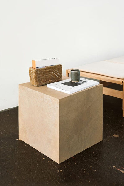 Mater Cube side table styled with books and decorative objects