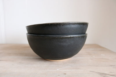Matte black handmade ceramic cereal bowl side view