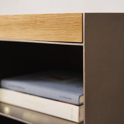 Close-up of Milan media console open shelf with book storage