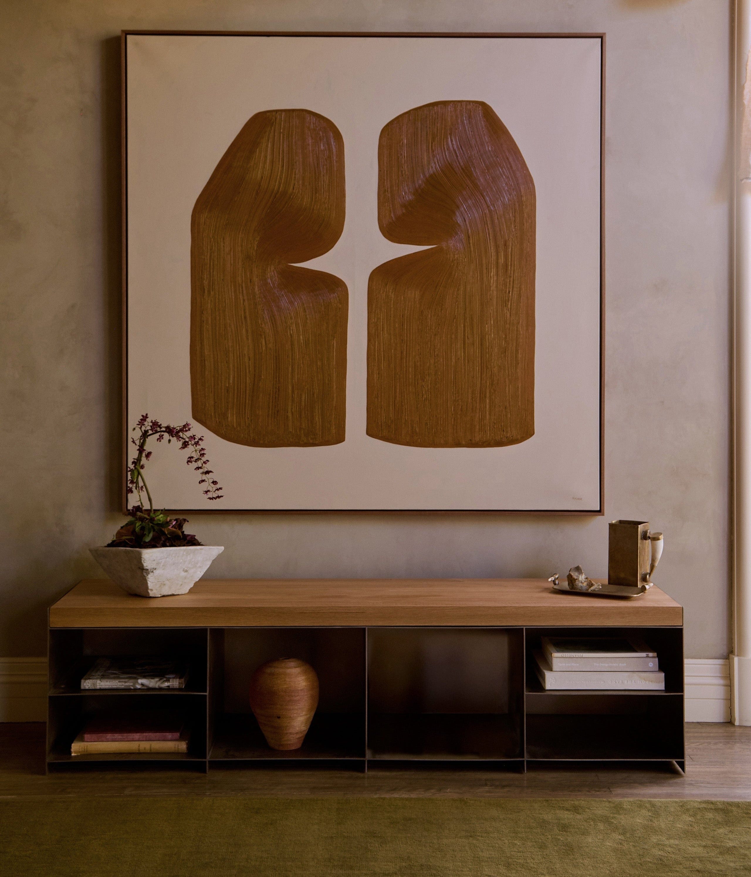 Milan media console beneath wall art with open shelving