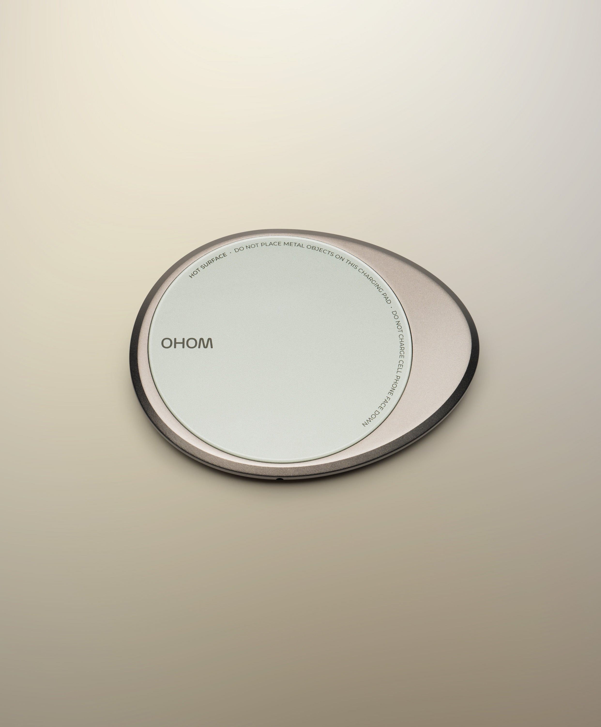 Minimalist OHOM warming and charging pad close-up