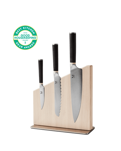 Modern magnetic knife stand with three Japanese-inspired kitchen knives