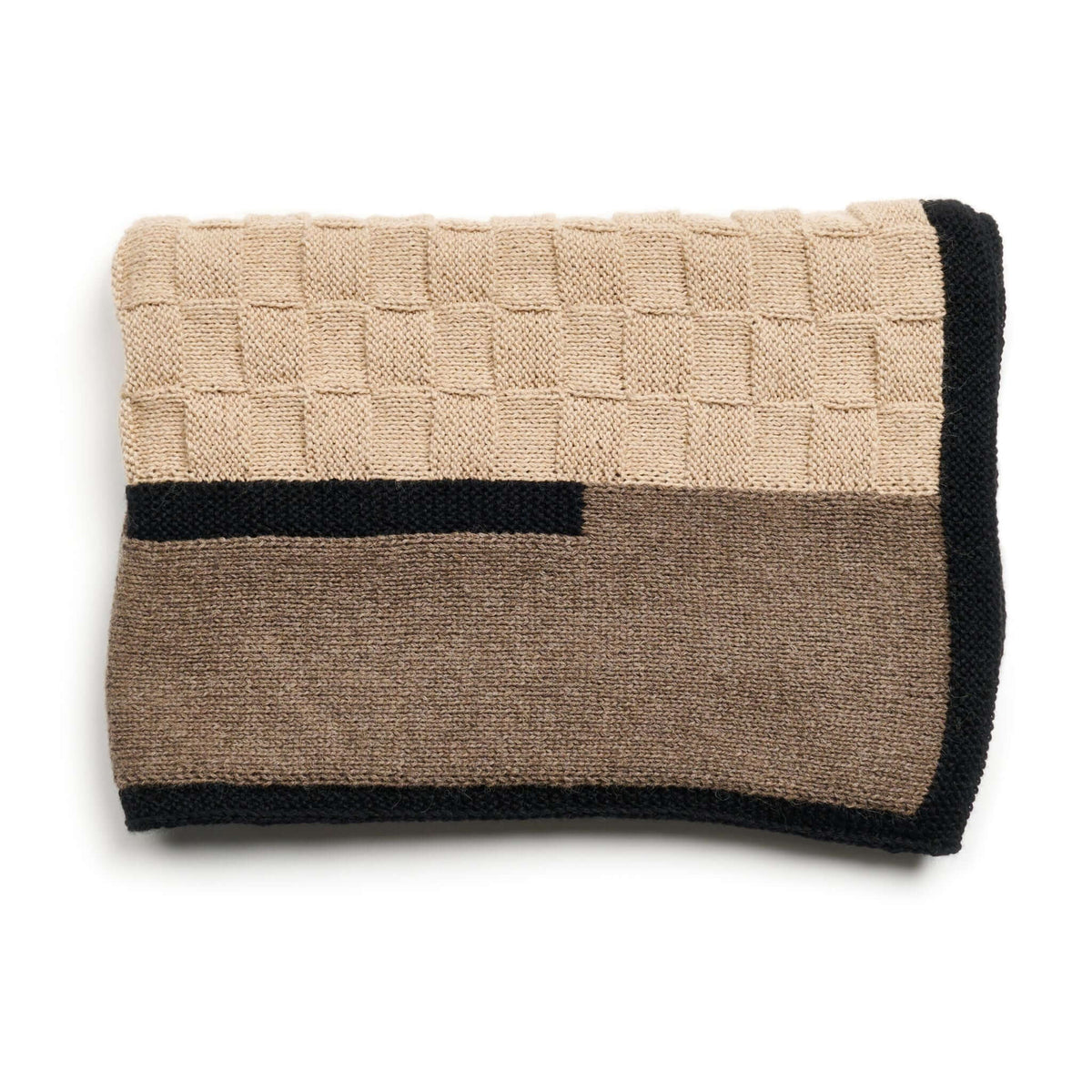 Folded brown and beige side of the blanket with black linear trim.