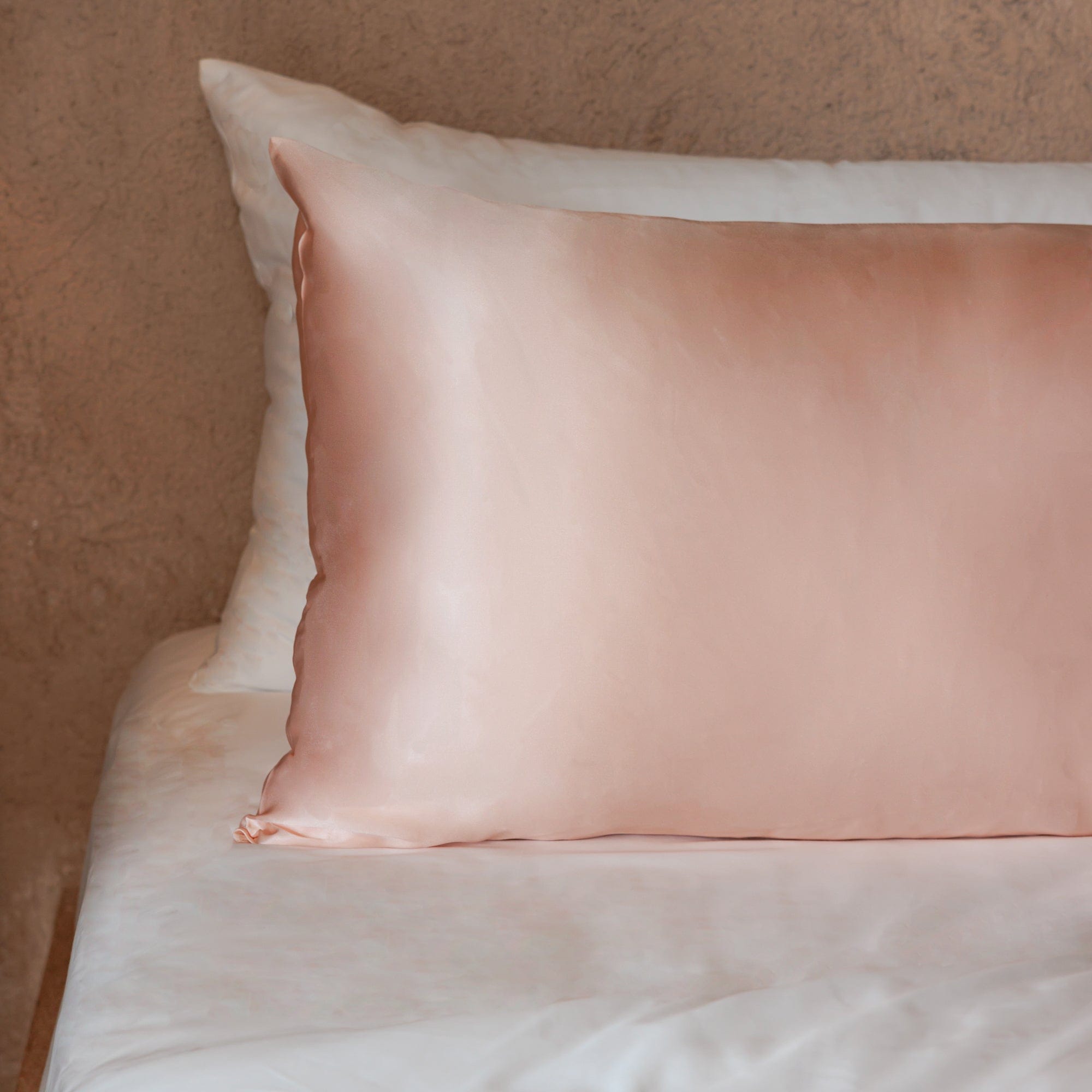 Mulberry Silk Pillowcase in Rosewater on bed