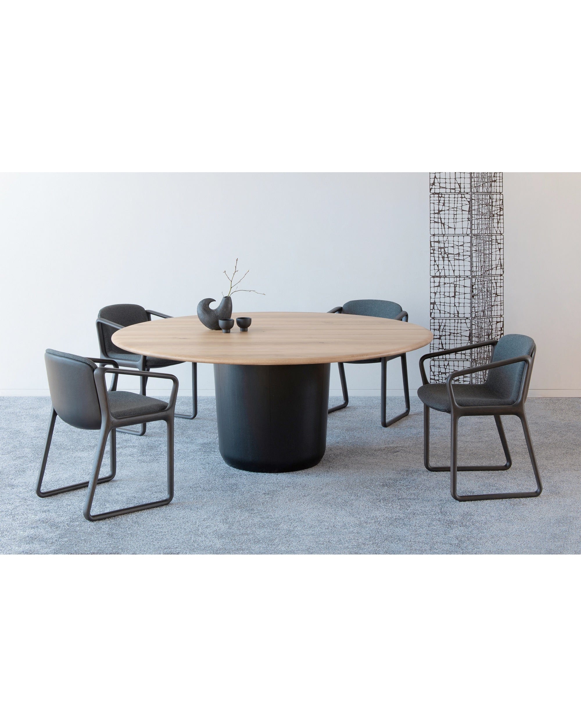 ONE Round CondeHouse dining table styled with modern dining chairs