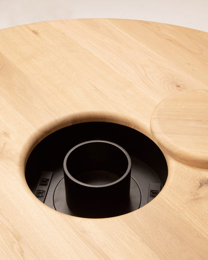 ONE Round Table Japanese Oak Natural Close-up of concealed power outlet in round oak dining table