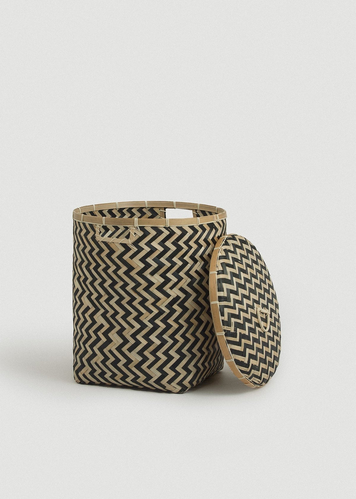 Large open Java basket with the removable patterned lid propped beside it.