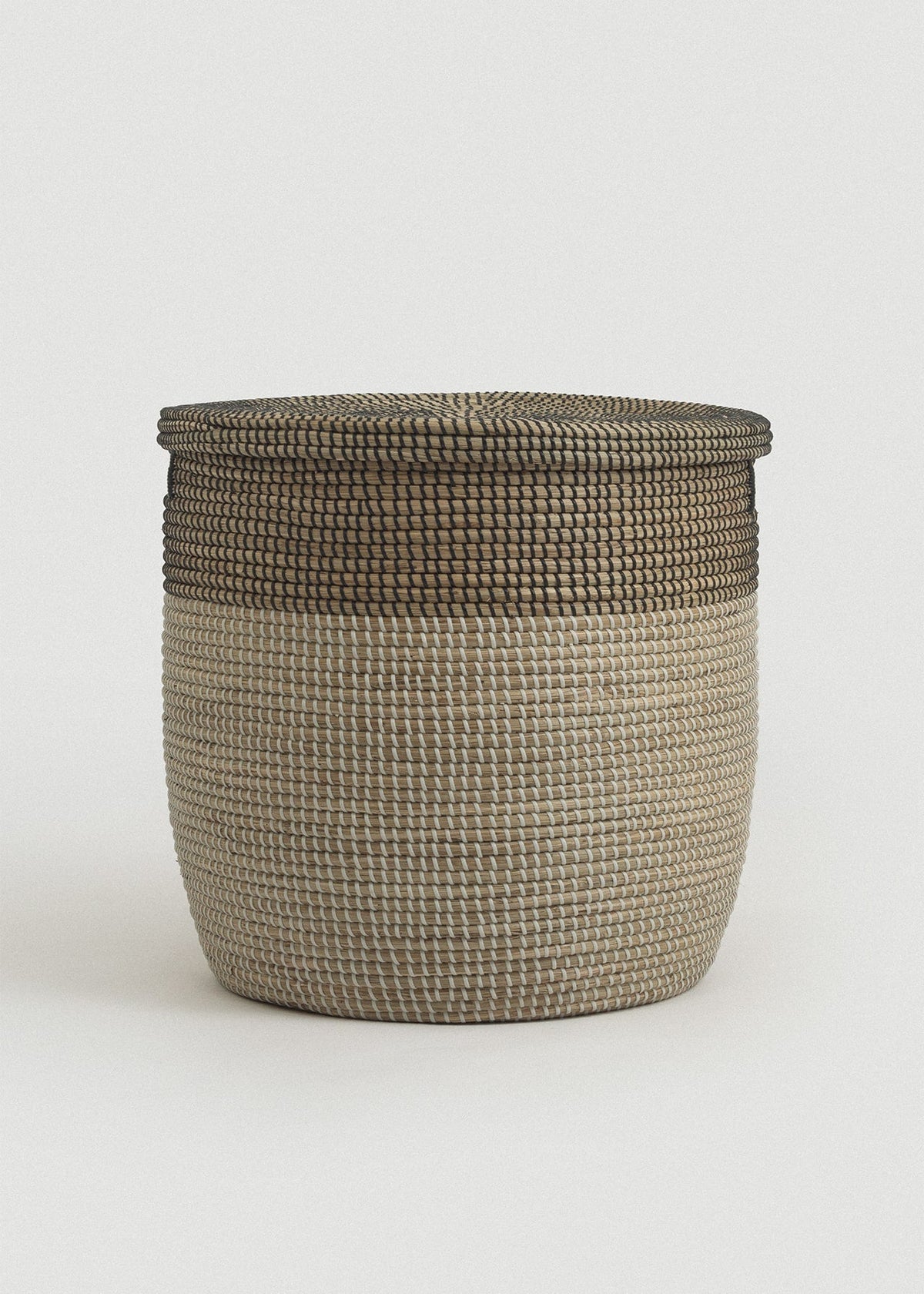 Front view of the Large Black Medina basket showing its tall rounded shape and dark woven rim.
