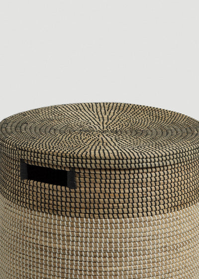 Close-up of the spiral-woven black-and-natural lid, dark upper band, and rectangular handle.