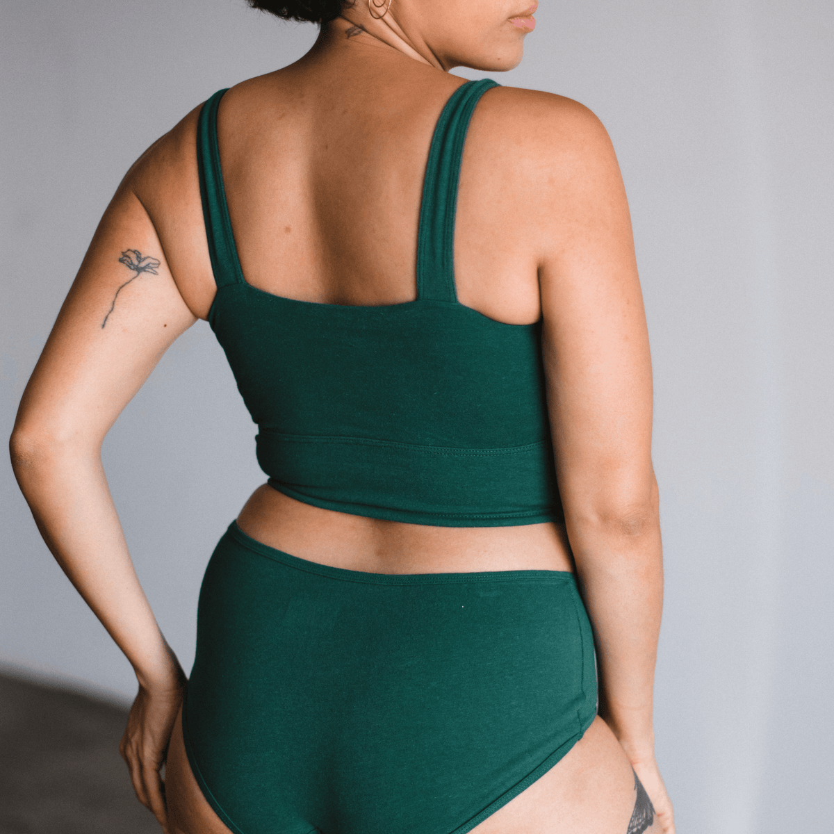 Back view of model wearing PROCLAIM Organic Cotton Square Neck Bralette in Lagoon