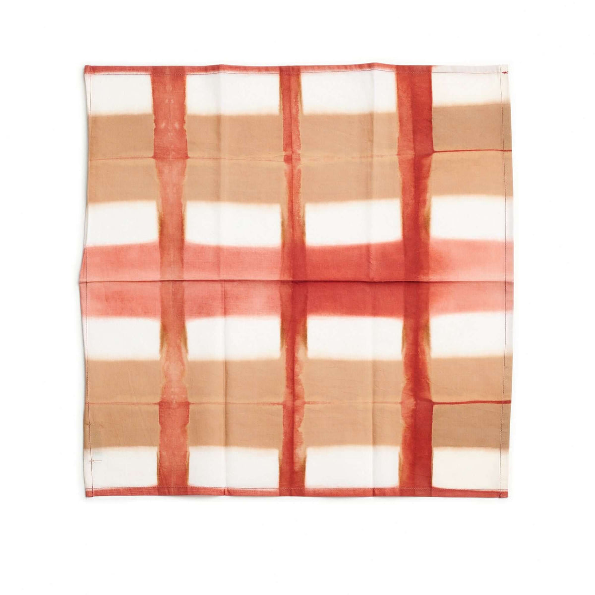 Coral-red color variation of the Chowk clamp-dyed cotton napkin with tan and white grid sections