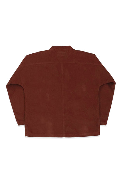 Back product view of the rust-red Raj corduroy coat.